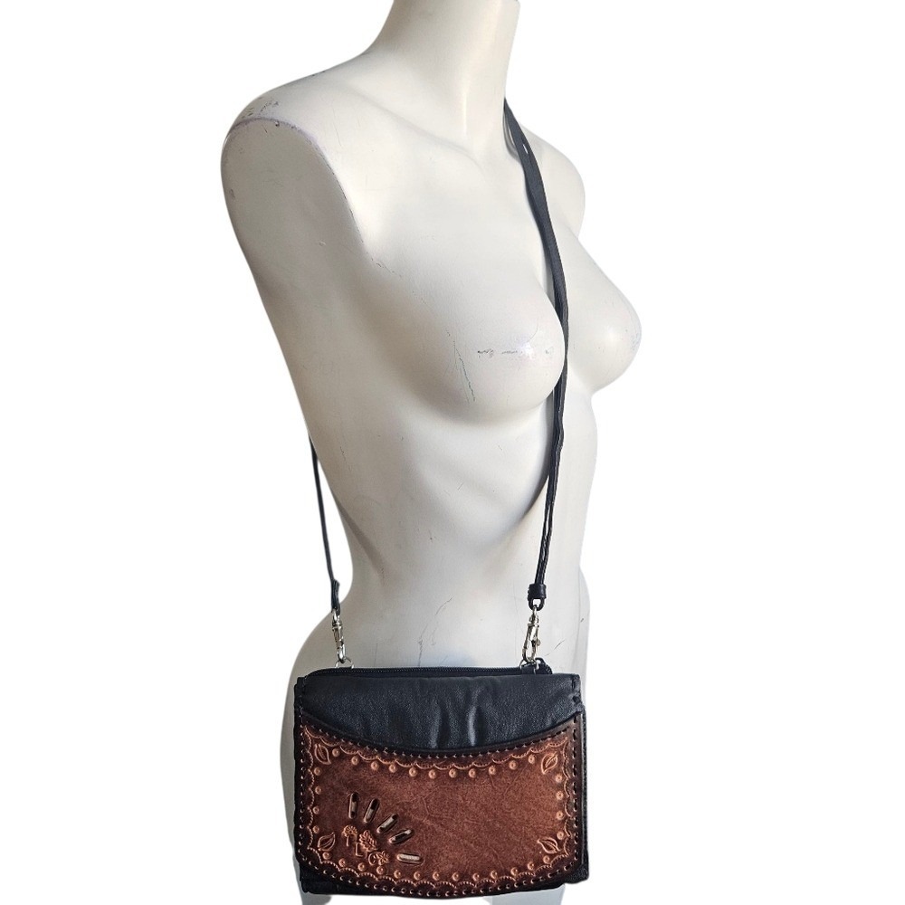 Black and brown leather crossbody bag with tooled leather detailing